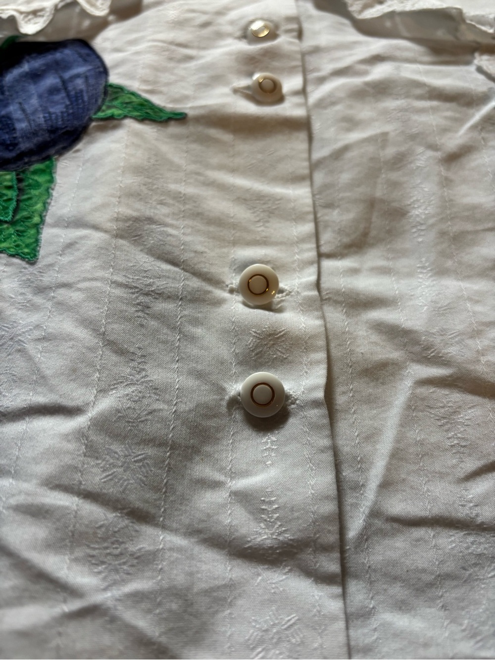 White Short-Sleeve Button-Up Top with Blue Floral Applique - Picture 2 of 6